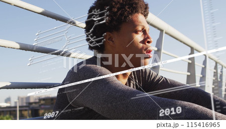 Image of data processing over african american man sitting 115416965