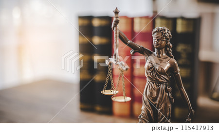 Lady Justice Holding Scales of Law in a Courtroom - Symbolizing Equality, Fairness, and Legal Proceedings Lady Justice Holding Scales of Law in a Courtroom - Symbolizing Equality, Fairness, and Legal Proceedings 115417913