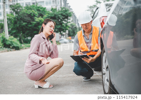 male insurance officer came to help inspect a customer's car that had an accident. Concept for vehicle crash, insurance claim. 115417924