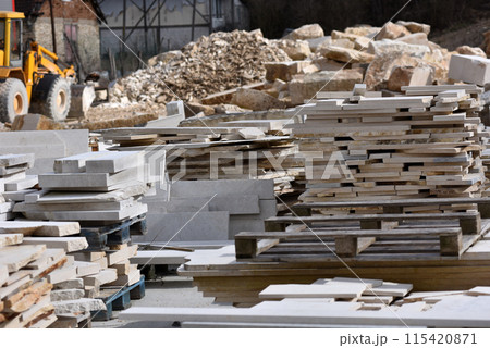 Stacked limestone slabs and tiles 115420871