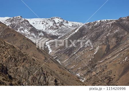 First snow in mountains. Autumn nature, brown mountain slope First snow in mountains. Autumn nature, brown mountain slope 115420996