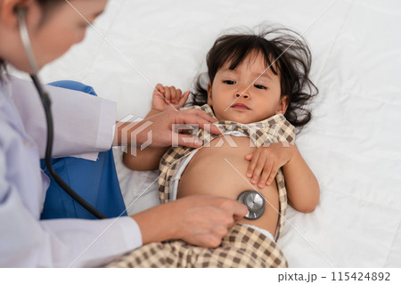 doctor using stethoscope to istening toddler's chest. baby health concept doctor using stethoscope to istening toddler's chest. baby health concept 115424892