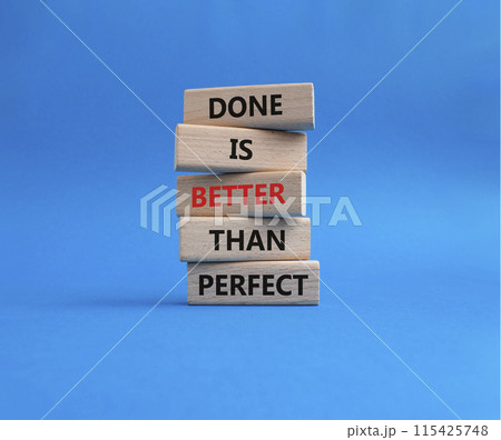 Done is better than Perfect symbol. Wooden blocks with words Done is better than Perfect. Beautiful blue background. Business concept. Copy space. 115425748