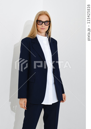 Studio portrait of self-assured business woman 115425816