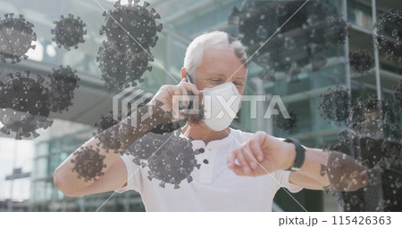 Image of covid 19 cells over senior man wearing face mask 115426363