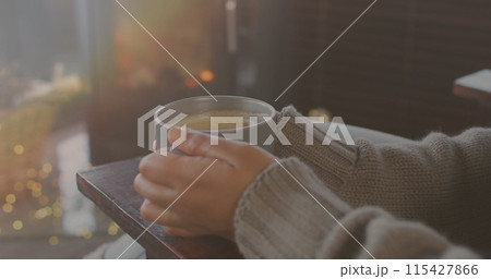 Image of biracial woman drinking tea over clouds 115427866