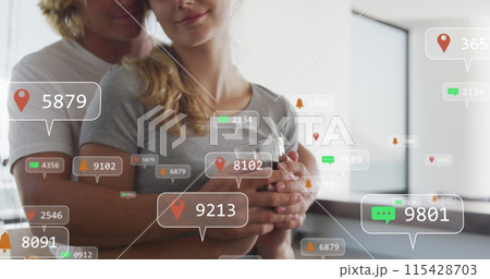 Image of social media icons on banners over caucasian couple in love embracing on balcony 115428703