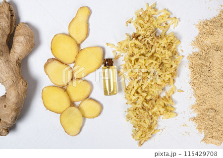 Ginger in different states - root, cut pieces, oil, grated, dry powder. 115429708