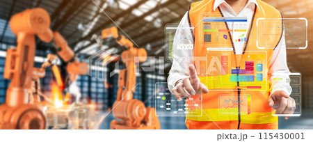 Technician or engineer work with robotic arms in factory 115430001