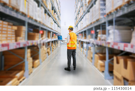 Asian worker or engineer in warehouse with cardboard boxes 115430014