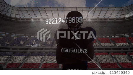 Multiple changing numbers over silhouette of male rugby player against sports stadium in background 115430340