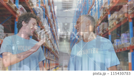 Statistical data processing over two caucasian male volunteers high fiving each other at warehouse 115430783