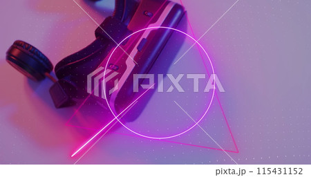 Image of neon shapes over image game computer pads Image of neon shapes over image game computer pads 115431152