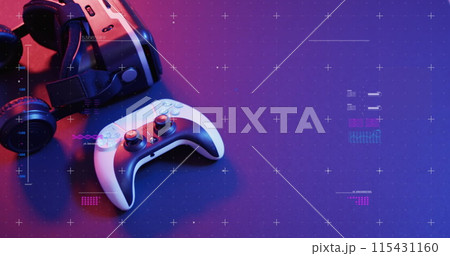 A gaming controller and camera rest on a vibrant surface A gaming controller and camera rest on a vibrant surface 115431160