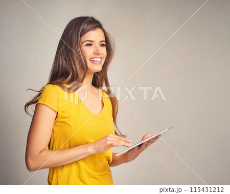 Woman, happy and thinking with tablet in studio background for social media, networking and communication. Female person, smile and good news with streaming platform on website for entertainment Woman, happy and thinking with tablet in studio background for social media, networking and communication. Female person, smile and good news with streaming platform on website for entertainment 115431212