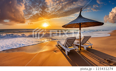 Two empty sun loungers under white parasol on the sandy beach near the sea 115431274