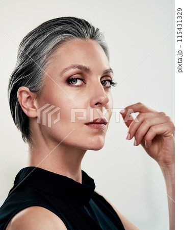 Portrait, mature woman and makeup by white background for cosmetics, wellness and spa treatment. Collagen, anti aging and dermatology for fine lines, wrinkles and glow in studio with female person 115431329