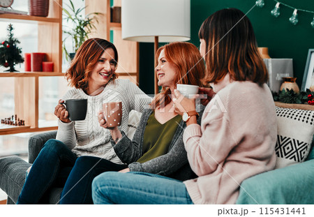 Christmas, group and friends with coffee, gossip or happy in vacation of festive season or laughing. Home, lounge or people with hot chocolate, warm or smile of girls, together and excited for winter Christmas, group and friends with coffee, gossip or happy in vacation of festive season or laughing. Home, lounge or people with hot chocolate, warm or smile of girls, together and excited for winter 115431441