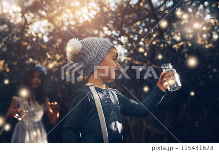 Fireflies, jar and outdoor in nature at evening time with glow, shine and children playing in forest. Boy, girl and happy in woods as siblings with fantasy for unique mystical fairy and magic light 115431628