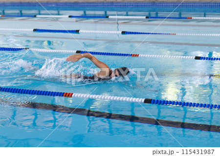 Swimmer in action at a competitive pool event 115431987