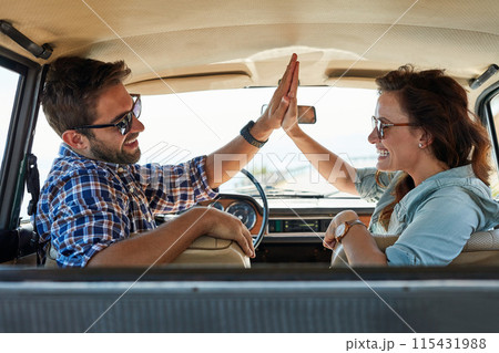 Couple, high five and car for travel, road trip and destination achievement with smile. Vehicle, transport and married people with hand gesture for journey goal, adventure and cheers for vacation 115431988