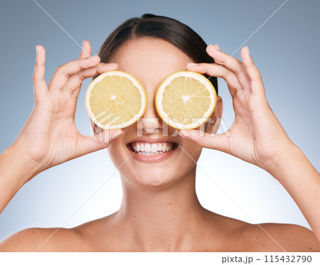 Happy woman, skincare and beauty with orange slices with fruit, vitamin c or natural in blue background. Female person, face and organic for cosmetic, pride or glow for dermatology in studio backdrop Happy woman, skincare and beauty with orange slices with fruit, vitamin c or natural in blue background. Female person, face and organic for cosmetic, pride or glow for dermatology in studio backdrop 115432790