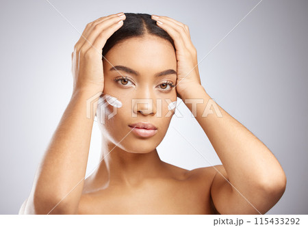 Sunscreen, cream and portrait of woman for skincare and dermatology in studio background. Calm, girl and model relax with lotion moisturizer on face for healthy glow or natural beauty and cosmetics 115433292