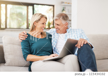 Couple, couch and laptop with smile in home, streaming and relax in living room for movies. Internet, computer and online website for watching with married people, calm and lounge with technology 115434102