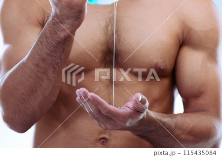 Hands, chest and soap with man in shower for grooming, hygiene and wellness in bathroom. Skincare, dermatology and liquid for cleaning, cosmetics and muscular with cleansing gel for body care Hands, chest and soap with man in shower for grooming, hygiene and wellness in bathroom. Skincare, dermatology and liquid for cleaning, cosmetics and muscular with cleansing gel for body care 115435084