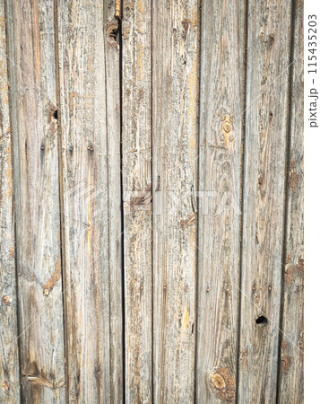 Texture of a wooden plank fence with vertical wood strips, gray brown wooden wall texture 115435203