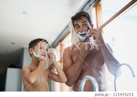 Bathroom, morning and father shaving with kid for hygiene, grooming and health routine. Bonding, child development and boy learning razor facial epilation treatment with man for skincare at home. 115435253