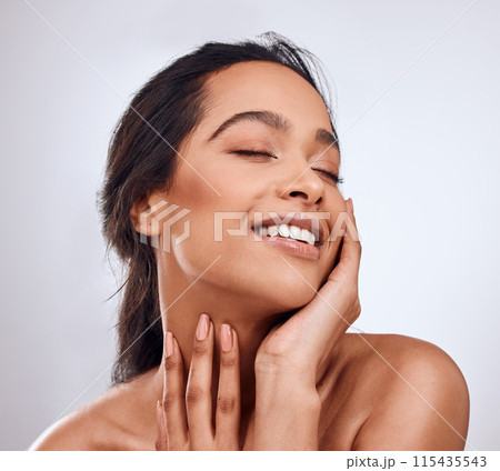Beauty, smile and hands on face of woman in studio for skincare, treatment and glowing skin on white background. Dermatology, wellness or Mexican model with cosmetic, shine and texture satisfaction 115435543