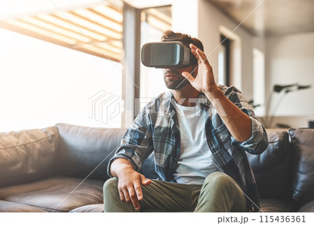 Creative, man and virtual reality headset in home lounge of cyber experience, metaverse system or gaming connection. .Gamer, VR or games in living room with future, innovation and ui technology 115436361
