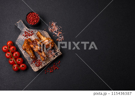 Delicious crispy grilled wings with teriyaki sauce with salt, spices 115436387