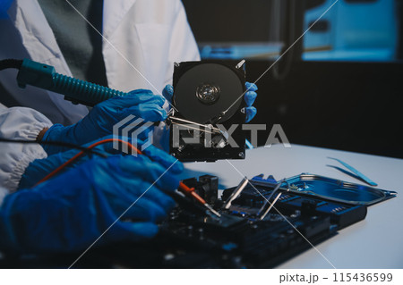 Close up of Technician measuring voltage electronic circuit board television, Service after sale fix electric equipment within insurance. Close up of Technician measuring voltage electronic circuit board television, Service after sale fix electric equipment within insurance. 115436599