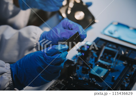 Close up of Technician measuring voltage electronic circuit board television, Service after sale fix electric equipment within insurance. 115436629
