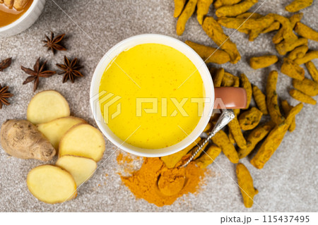 Natural Ayurvedic drink golden milk with turmeric and spices in a mug 115437495