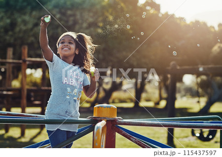 Play, girl and bubbles with playground, fun and love for summer break and positive. Kid, obstacle course and park equipment for joy, outside and happy child smile with countryside merry go round 115437597