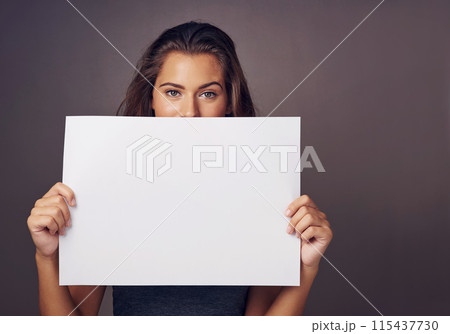 Woman, portrait and studio background with board for mockup, idea for advertising or social media billboard. Female person, backdrop and empty poster for information, news notification or promotion 115437730