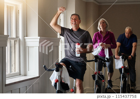 Spinning class, winning or happy man on cycling bike in workout or training for progress, health or wellness. Gym, success or excited mature person on bicycle machine for fitness, exercise and goal Spinning class, winning or happy man on cycling bike in workout or training for progress, health or wellness. Gym, success or excited mature person on bicycle machine for fitness, exercise and goal 115437758