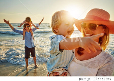 Happy family, mother and beach with little boy for bonding, outdoor holiday or weekend in nature sunset. Mom, father or children with smile for embrace, love or care in sunshine by ocean coast or sea Happy family, mother and beach with little boy for bonding, outdoor holiday or weekend in nature sunset. Mom, father or children with smile for embrace, love or care in sunshine by ocean coast or sea 115437865