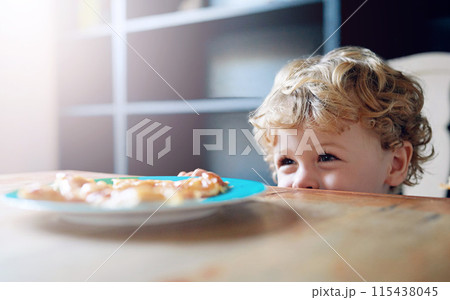 Home, boy and kid in kitchen, lunch on plate and curious with happiness, nutrition and wellness. Childhood, behaviour and furniture with food, healthy meal and table with cookies, biscuit and smile 115438045
