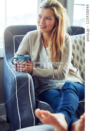 Thinking, smile or woman drinking coffee in home living room for morning breakfast, latte or espresso to relax. Tea, dream or happy person on sofa for peace, calm or planning future decision in house 115438049