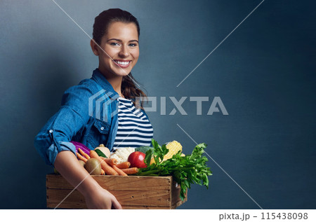 Studio, farmer or woman in portrait with vegetables, nutrition and fresh products in basket by mockup. Small business, organic or harvest with female supplier, agriculture and food by gray background Studio, farmer or woman in portrait with vegetables, nutrition and fresh products in basket by mockup. Small business, organic or harvest with female supplier, agriculture and food by gray background 115438098