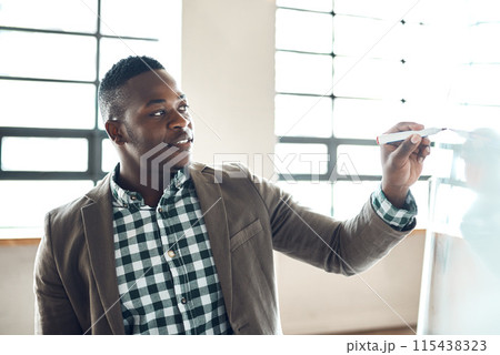 Black man, coaching and writing with whiteboard for presentation or training staff at office. African businessman, male person or employee taking notes on board for meeting, task or idea at workplace 115438323