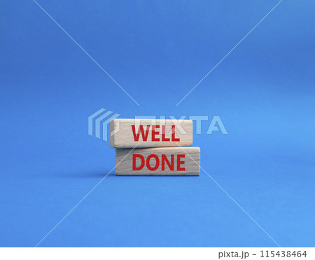 Well done symbol. Wooden blocks with words Well done. Beautiful blue background. Business and Well done concept. Copy space. Well done symbol. Wooden blocks with words Well done. Beautiful blue background. Business and Well done concept. Copy space. 115438464