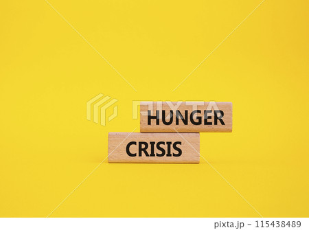 Hunger Crisis symbol. Wooden blocks with words Hunger Crisis. Beautiful yellow background. Business and Hunger Crisis concept. Copy space. Hunger Crisis symbol. Wooden blocks with words Hunger Crisis. Beautiful yellow background. Business and Hunger Crisis concept. Copy space. 115438489