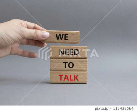 We need to talk symbol. Concept words We need to talk on wooden blocks. Beautiful grey background. Businessman hand. Business and We need to talk concept. Copy space. We need to talk symbol. Concept words We need to talk on wooden blocks. Beautiful grey background. Businessman hand. Business and We need to talk concept. Copy space. 115438564