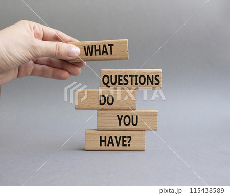 Questions symbol. Wooden blocks with words What Questions do you have. Beautiful grey background. Businessman hand. Business and What Questions do you have concept. Copy space. Questions symbol. Wooden blocks with words What Questions do you have. Beautiful grey background. Businessman hand. Business and What Questions do you have concept. Copy space. 115438589