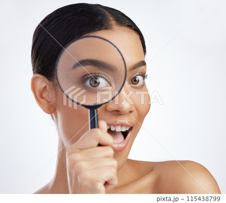 Skincare, portrait and woman with magnifying glass in studio for skin, inspection and cosmetics on white background. Face, beauty and girl model with search lens for fine lines, acne or dermatology Skincare, portrait and woman with magnifying glass in studio for skin, inspection and cosmetics on white background. Face, beauty and girl model with search lens for fine lines, acne or dermatology 115438799